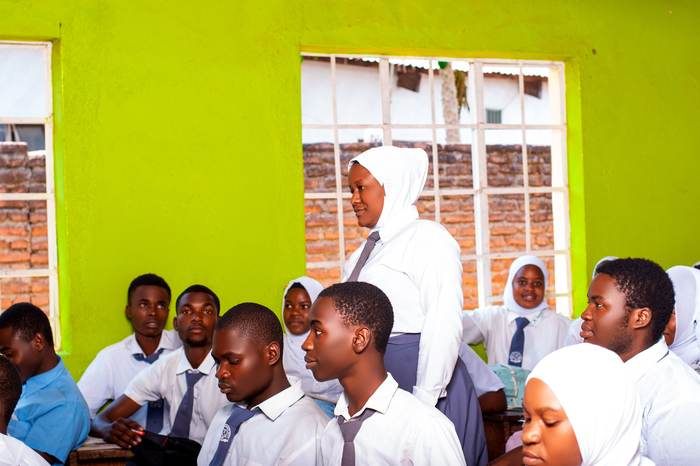 Student standing to answer a question in class